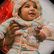Sarvesh Aj joined the competition — help win amazing prizes! baby, child, smiling, hoodie, striped_clothing, hands, warm_clothing, cozy, indoor, portrait, cute, infant, person, happy, colorful, patterned_cloth, fuzzy_texture, buttoned_clothing, closeup, vignette