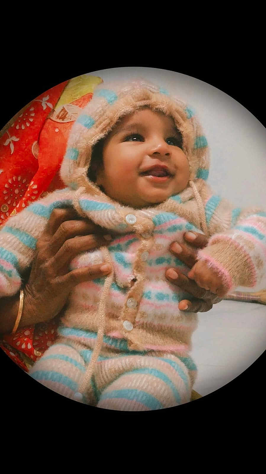 Sarvesh Aj joined the competition — help win amazing prizes! baby, child, smiling, hoodie, striped_clothing, hands, warm_clothing, cozy, indoor, portrait, cute, infant, person, happy, colorful, patterned_cloth, fuzzy_texture, buttoned_clothing, closeup, vignette