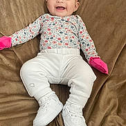 Jazlyn joined the competition — help win amazing prizes! baby, babylaughing, clothing, face, footwear, happy, hat, head, hosiery, jeans, pants, person, photography, portrait, shoe, sitting, sleeve, smile, sneaker, sock