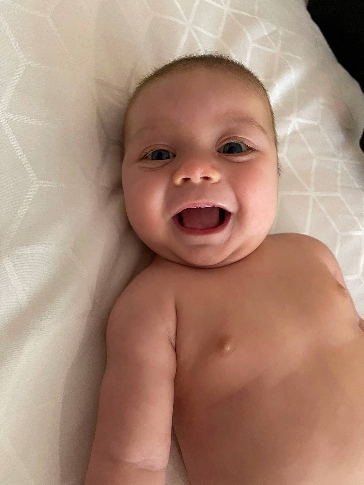 Ford is registered to the contest to win money with this photo: baby, cheek, chin, ear, eye, eyebrow, face, facial_expression, finger, forehead, iris, jaw, lip, mouth, muscle, neck, nose, person, skin, smile