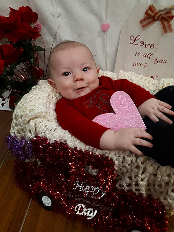 Jeffree joined the competition — help win amazing prizes! baby, baby_toddler_clothing, child, christmas, fur, holiday, outerwear, person, pink, product, red, sitting, skin, smile, toddler