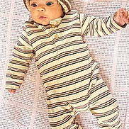 Naithan is registered to the contest to win money with this photo: baby, infant, striped_clothing, knit_hat, blanket, lying_down, cute, child, portrait, one_person, indoors, soft_texture, warm_clothing, cozy, baby_girl, baby_boy, small_hands, sleepwear, newborn, looking_away