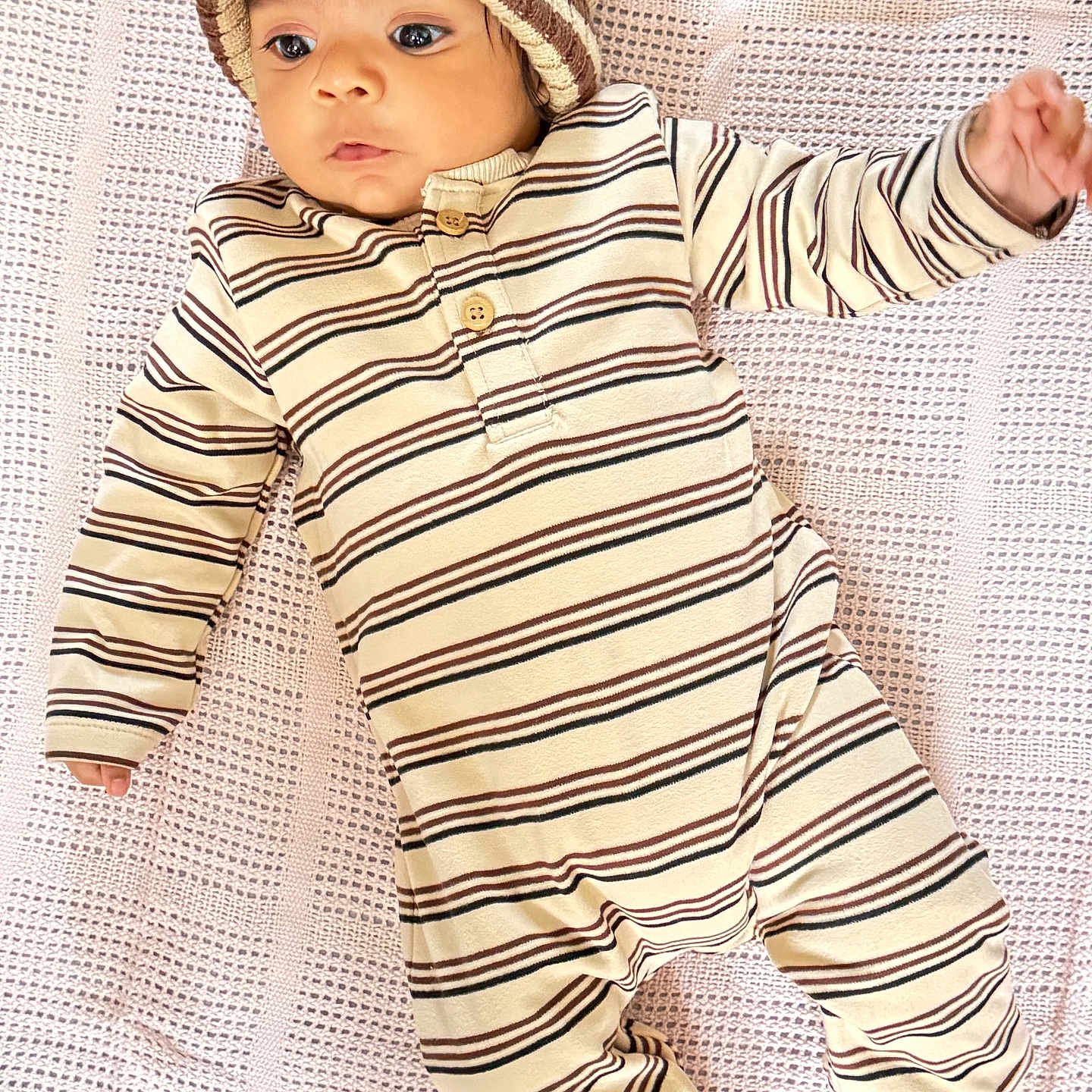 Naithan is registered to the contest to win money with this photo: baby, baby_boy, baby_girl, blanket, child, cozy, cute, indoors, infant, knit_hat, looking_away, lying_down, newborn, one_person, portrait, sleepwear, small_hands, soft_texture, striped_clothing, warm_clothing