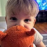 Ikaris is registered to the contest to win money with this photo: baby, blurred_background, child, couch, curious, cute, eyes, face, hair, home, indoor, living_room, orange, person, playful, portrait, soft_toy, stuffed_animal, toddler, toy