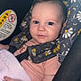 Aubrey is registered to the contest to win money with this photo: baby, child, car_seat, blue_eyes, blanket, floral_pattern, pink, infant, cute, smile, safety_harness, closeup, person, indoor, seat, head_support, young_child, small_hand, soft_texture, portrait