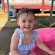 Freya joined the competition — help win amazing prizes! toddler, child, smiling, water, pool, swimsuit, outdoor, summer, happy, splashing, pink_pool, wet_hair, cute, play, sunlight, propane_tank, porch, concrete, blue, white