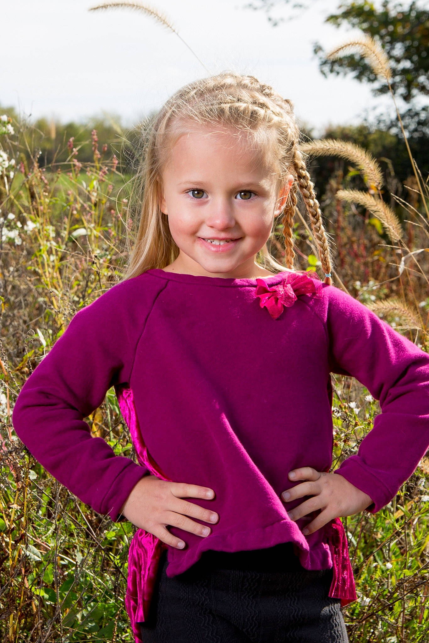 Brystol is registered to the contest to win money with this photo: blond, child, child_model, clothing, grass, joy, magenta, neck, outerwear, pattern, person, photography, pink, plant, purple, shoulder, sleeve, smile, toddler, tree