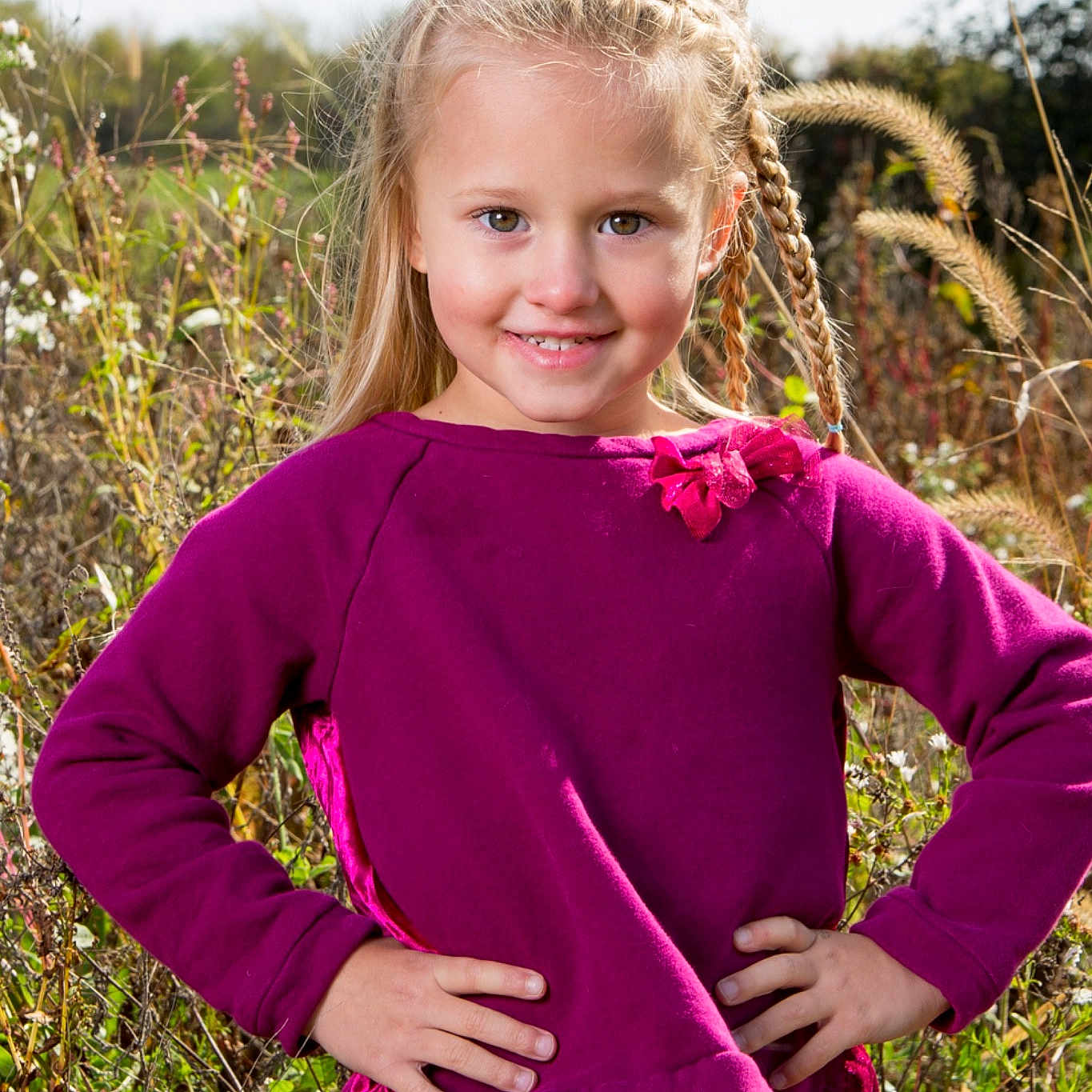 Brystol is registered to the contest to win money with this photo: blond, child, child_model, clothing, grass, joy, magenta, neck, outerwear, pattern, person, photography, pink, plant, purple, shoulder, sleeve, smile, toddler, tree