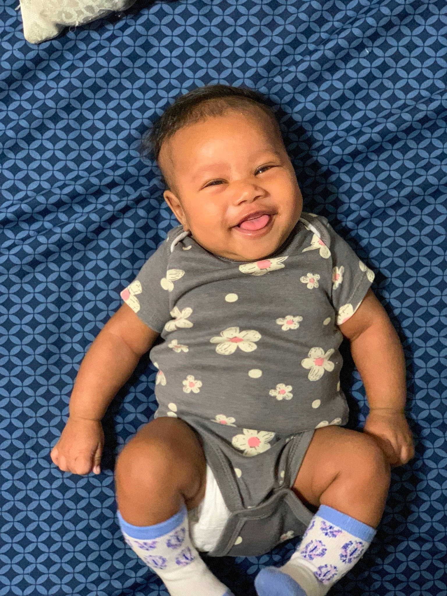 Tru is registered to the contest to win money with this photo: baby, baby_toddler_clothing, clothing, comfort, cool, happy, iris, joy, knee, leg, pattern, person, product, purple, skin, sleeve, smile, sock, t_shirt, textile