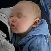 Lexie participe au concours pour gagner de l'argent avec cette photo : baby, sleeping, hoodie, blue_clothing, closeup, face, infant, child, soft_texture, blanket, skin, ear, cheek, peaceful, rest, nap, comfort, indoor, cozy, portrait