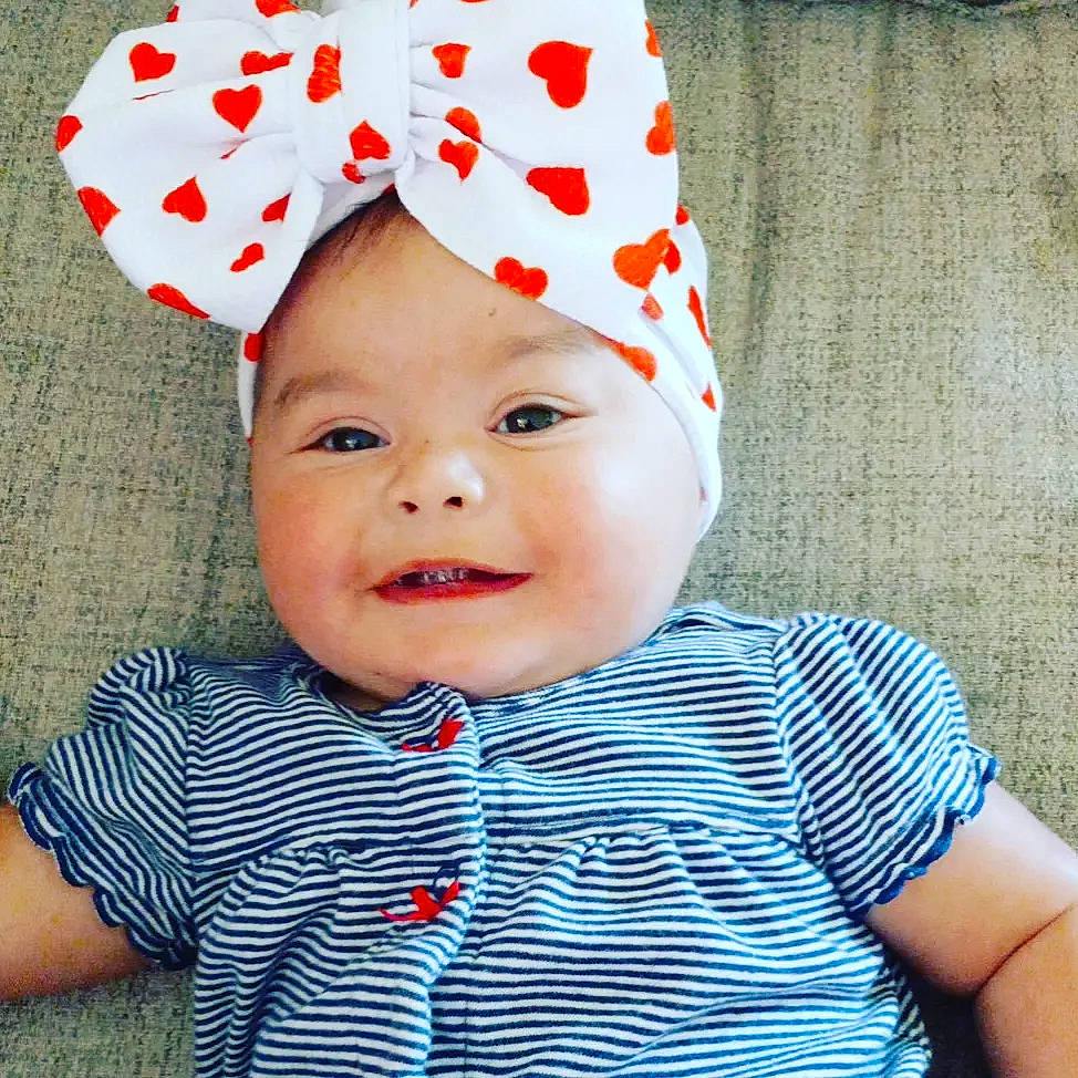 Penelope is registered to the contest to win money with this photo: baby, baby_toddler_clothing, cap, child, clothing, cool, costume_hat, happy, hat, headgear, headwear, knit_cap, outerwear, pattern, person, pink, sleeve, smile, t_shirt, textile