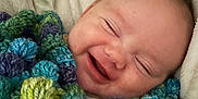 Draco joined the competition — help win amazing prizes! baby, smiling, blanket, knitted, colorful, face, happy, infant, cozy, cute, portrait, child, soft, warm, wrapped, sleepy, cuddly, closeup, head, peaceful