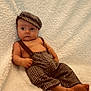 Draco joined the competition — help win amazing prizes! baby, infant, child, clothing, hat, pants, suspenders, bare_chest, blanket, texture, fabric, portrait, cute, foot, relaxed, indoor, soft, warm, fashion, seated