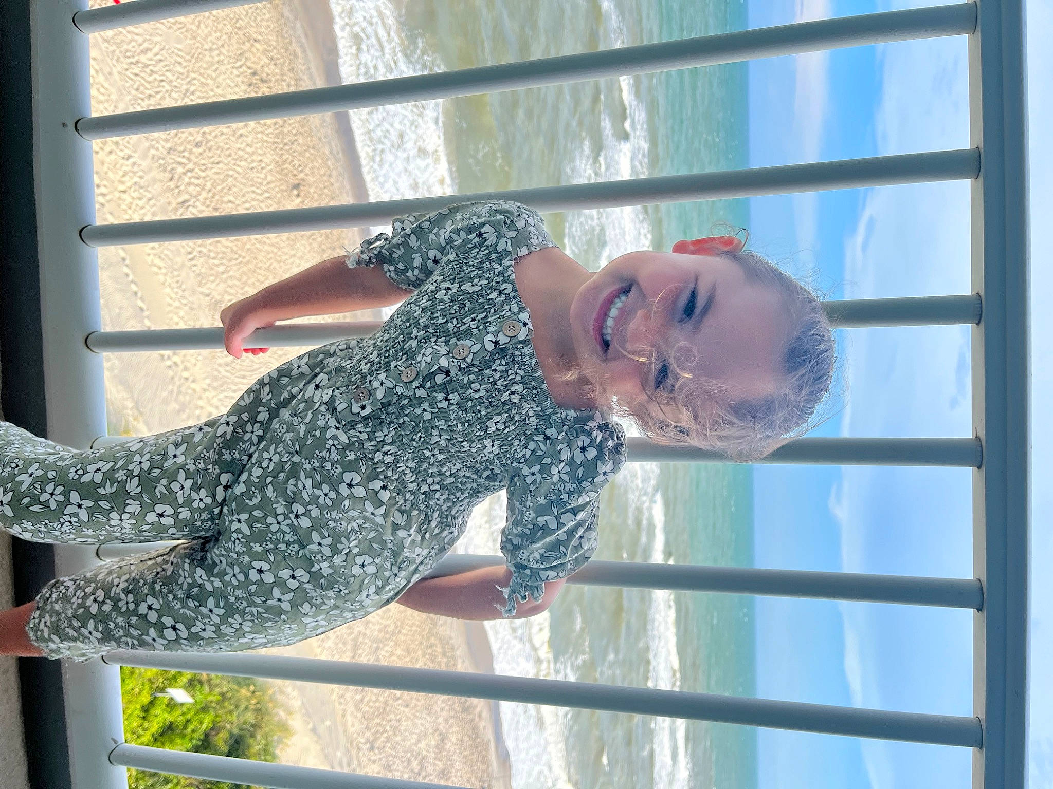 Jaylah is registered to the contest to win money with this photo: composite_material, elbow, electric_blue, fence, fixture, fun, happy, human_leg, joy, leisure, line, pattern, person, sky, sleeve, smile, thigh, waist, water, window