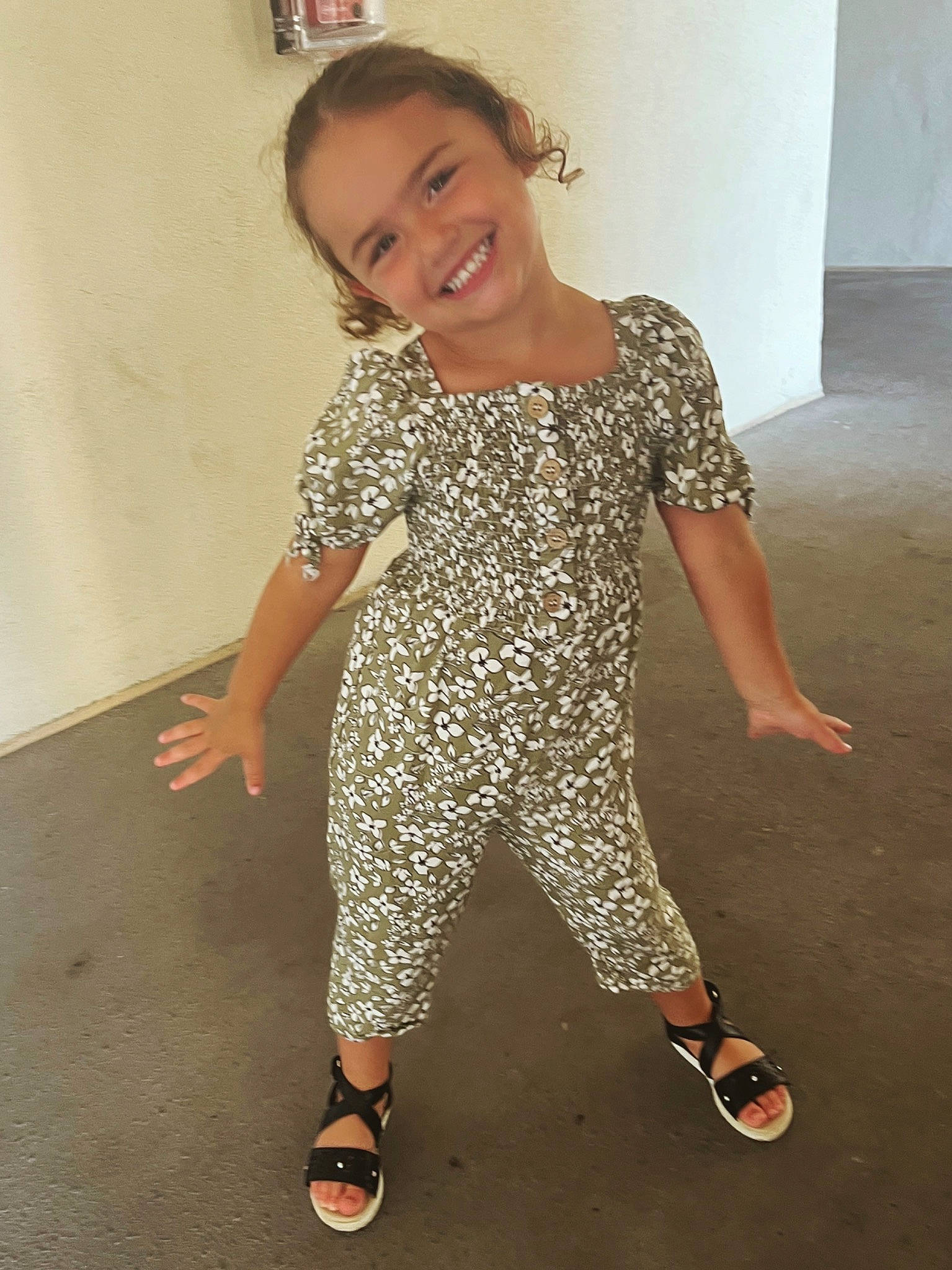 Jaylah is registered to the contest to win money with this photo: baby_toddler_clothing, barefoot, fashion_design, floor, flooring, footwear, happy, human_leg, joint, joy, knee, pattern, person, sandal, shoe, sleeve, smile, sneakers, t_shirt, thigh