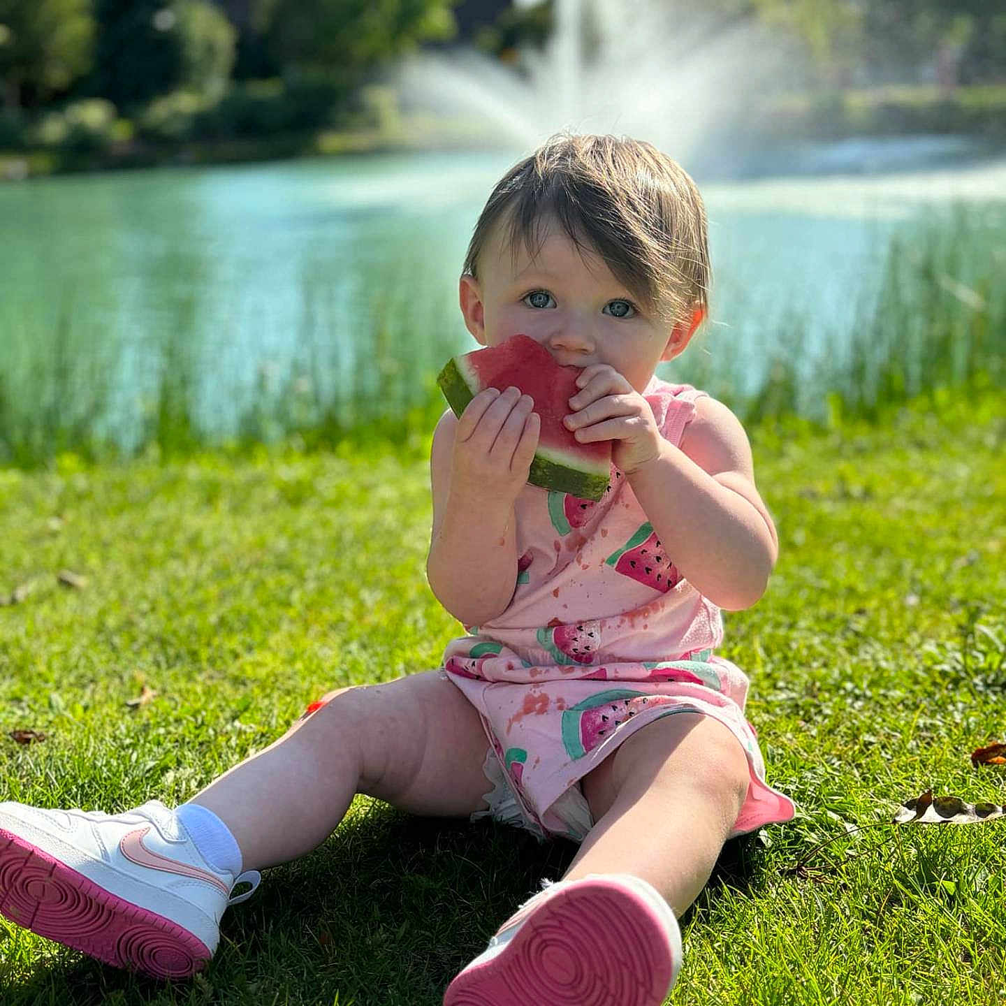 Raelynn joined the competition — help win amazing prizes! architecture, baby, clothing, face, footwear, grass, head, lawn, nature, outdoors, park, person, photography, plant, portrait, shoe, shorts, sitting, summer, water