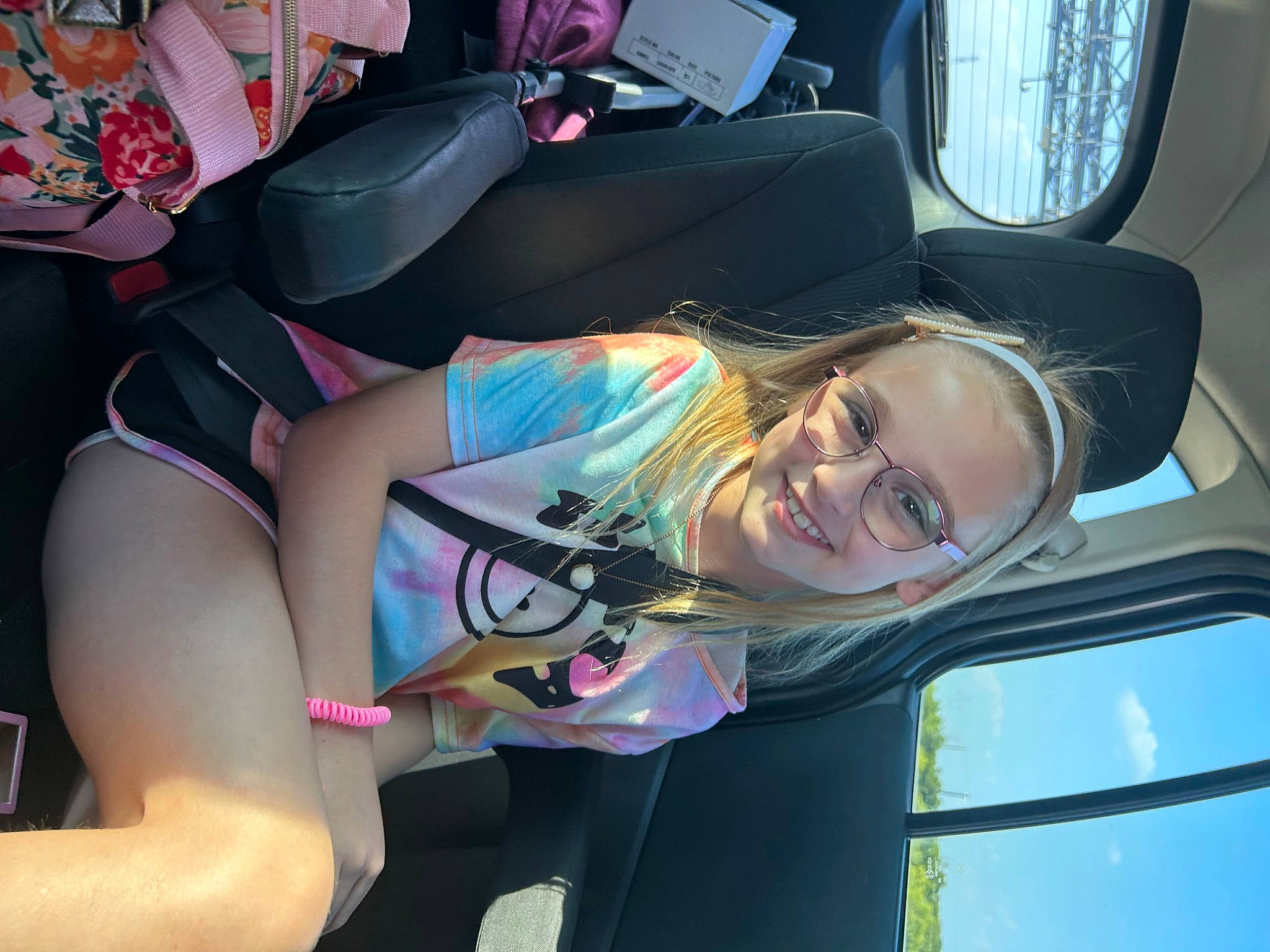 Kaitlyn is registered to the contest to win money with this photo: auto_part, automotive_design, automotive_exterior, car_seat, comfort, cool, elbow, event, family_car, fun, head_restraint, human_leg, joy, knee, luxury_vehicle, motor_vehicle, person, smile, thigh, vehicle