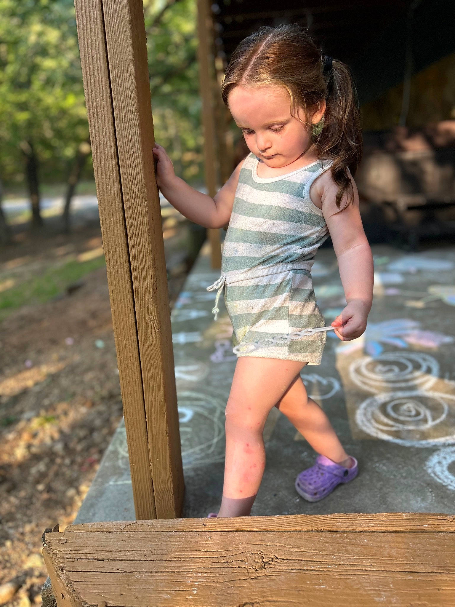 Charley is registered to the contest to win money with this photo: child, flash_photography, forest, fun, grass, hairstyle, happy, human_leg, leisure, people_in_nature, person, plant, recreation, shorts, sitting, standing, sunlight, t_shirt, toddler, tree