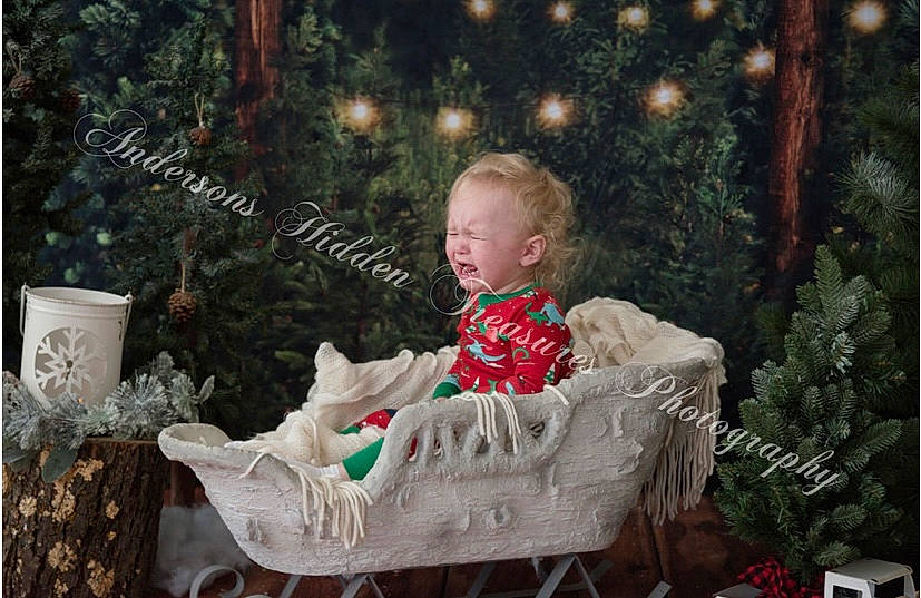 Keegan joined the competition — help win amazing prizes! baby, chair, child, christmas, christmas_decoration, christmas_ornament, comfort, dress, event, face, grass, happy, head, holiday, lap, person, plant, sitting, sorrow, toddler