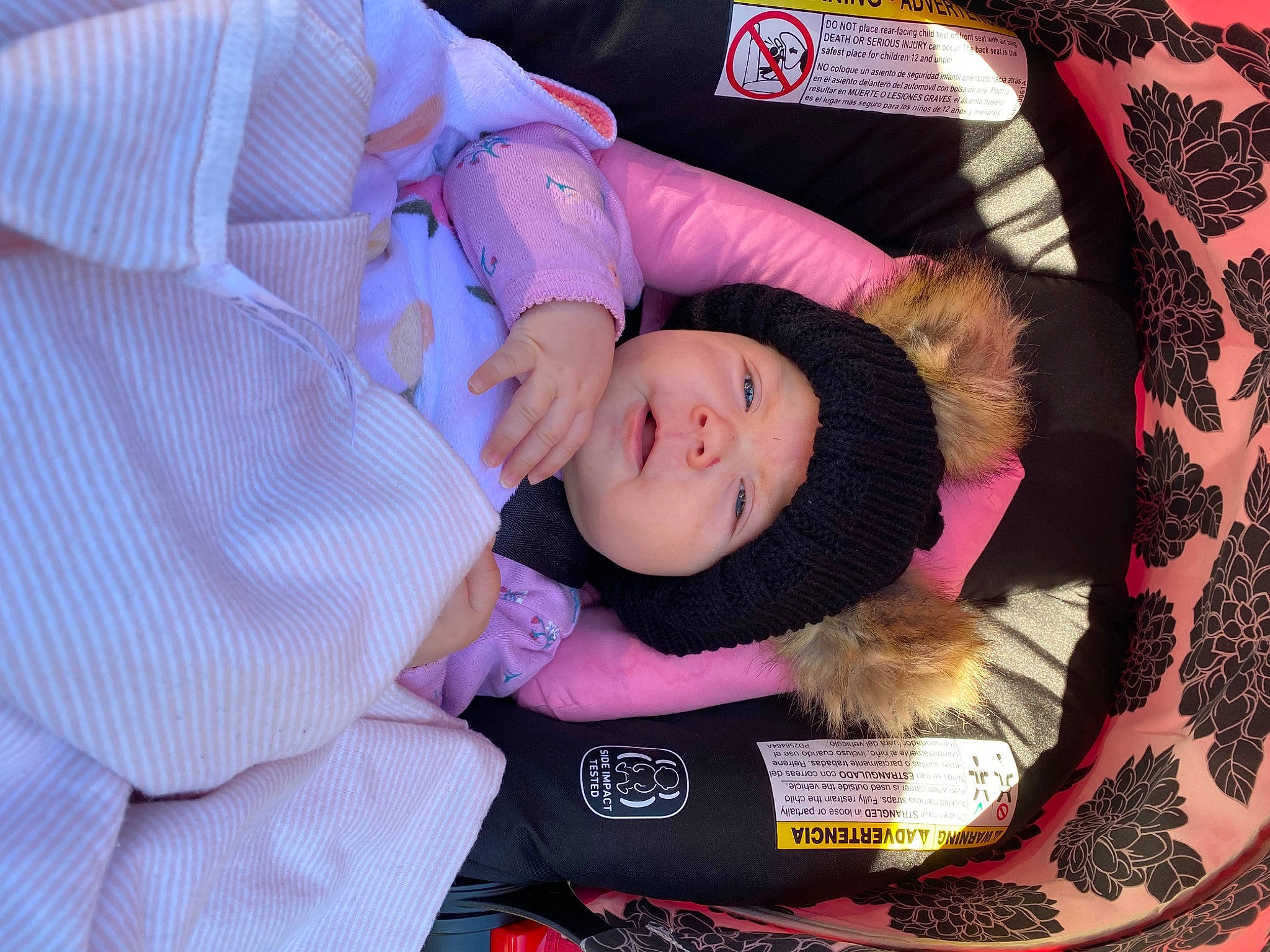 Leilani joined the competition — help win amazing prizes! baby, baby_products, baby_toddler_clothing, child, comfort, dress_shirt, fur, headwear, lap, linens, magenta, pattern, person, pink, purple, room, sleeve, toddler