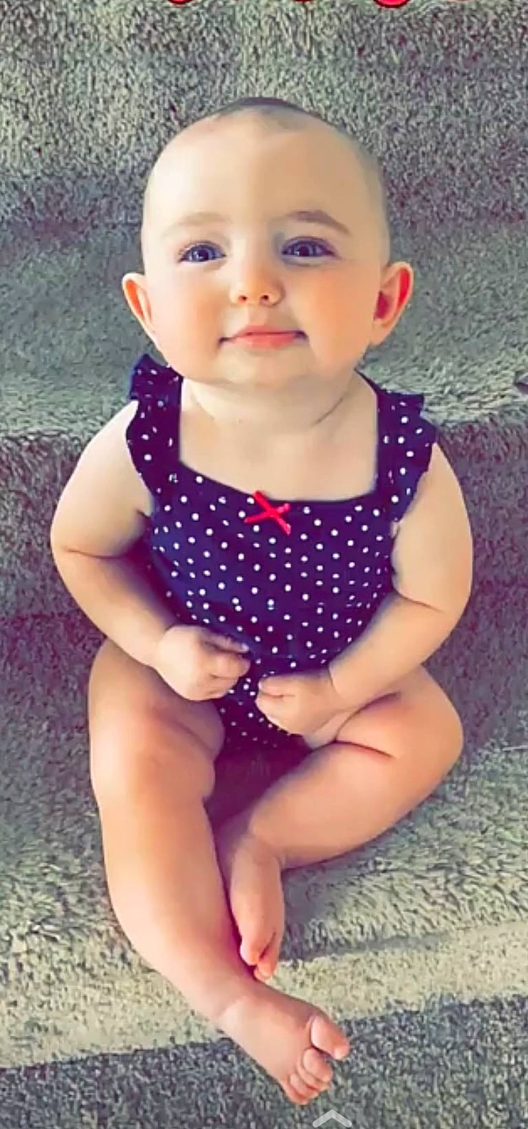 Kensley is registered to the contest to win money with this photo: baby_toddler_clothing, beauty, electric_blue, face, finger, grass, happy, head, human_leg, iris, joy, lip, neck, pattern, person, plant, skin, sleeve, smile, summer