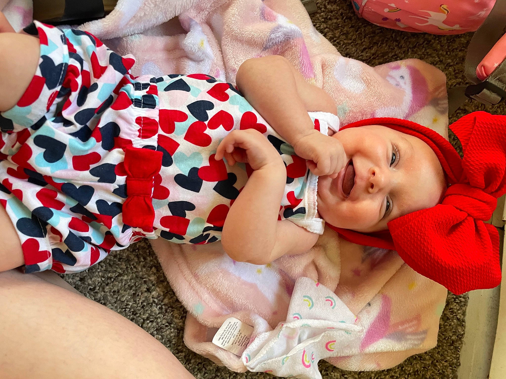 Journee joined the competition — help win amazing prizes! arm, baby_toddler_clothing, comfort, facial_expression, finger, glasses, hand, happy, hat, headwear, human_body, leg, lip, mouth, nail, pattern, person, pink, skin, thigh