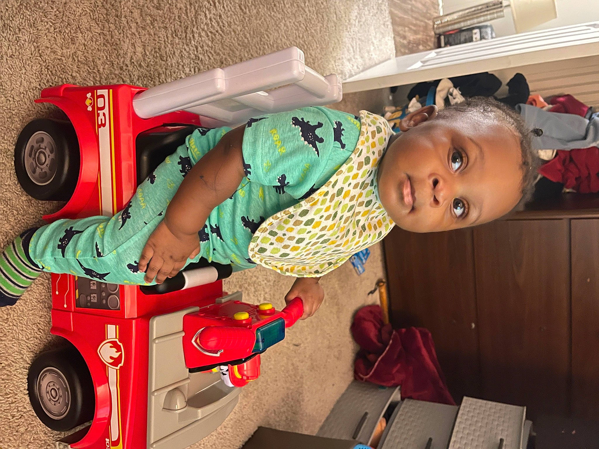 Jamari is registered to the contest to win money with this photo: automotive_design, automotive_tire, baby, baby_toddler_clothing, child, fender, fun, machine, motor_vehicle, person, product, riding_toy, rolling, smile, standing, tire, toddler, toy, tread, vehicle