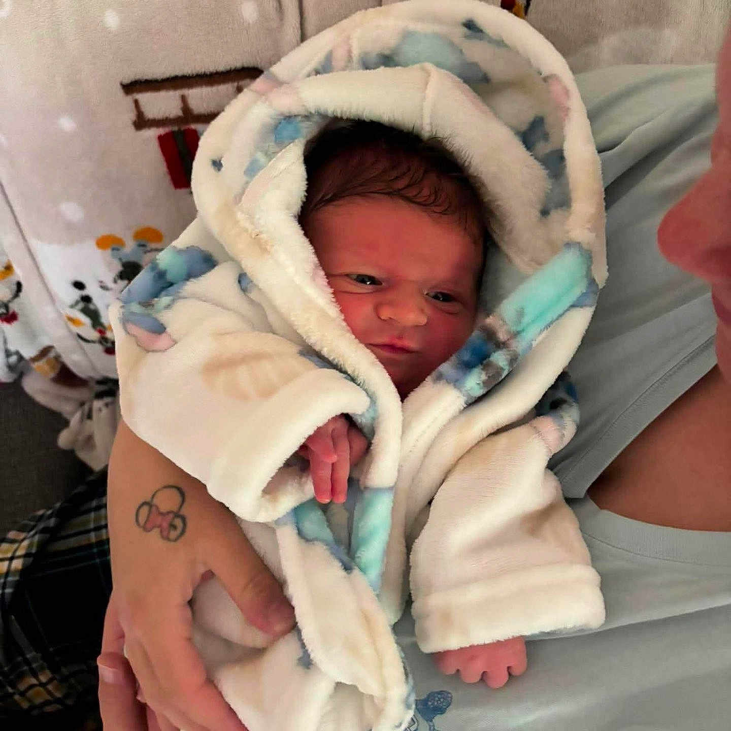 Flynn joined the competition — help win amazing prizes! newborn, baby, blanket, wrapped, infant, person, hand, tattoo, cozy, indoor, soft, cute, portrait, warm, clothing, holding, face, sleepwear, human, newborn_baby
