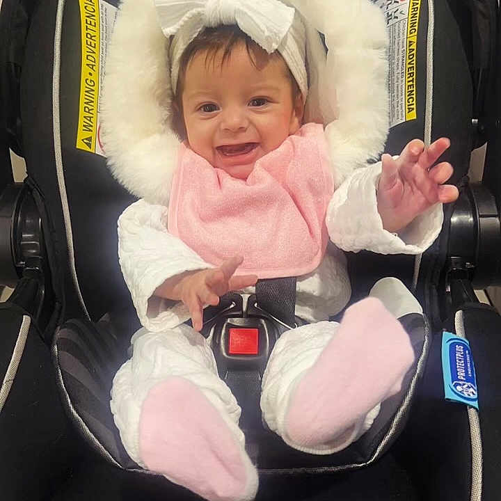 Myla joined the competition — help win amazing prizes! accessories, baby, babylaughing, car, car_interior, carseat, clothing, coat, costume, cushion, face, glove, happy, head, homedecor, jacket, newborn, person, photography, portrait