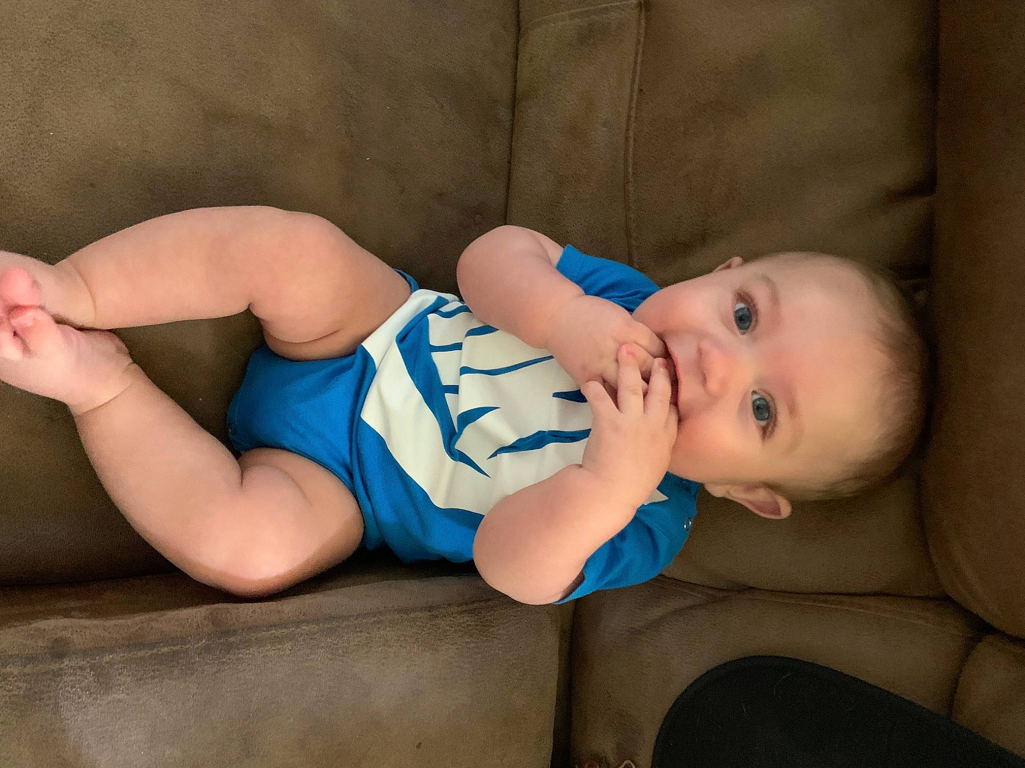 Kaysen is registered to the contest to win money with this photo: baby, baby_toddler_clothing, child, comfort, elbow, electric_blue, finger, flash_photography, foot, human_body, human_leg, knee, leg, pattern, person, sitting, sleeve, sock, textile, thigh