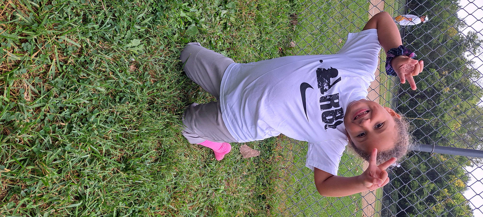 Topanga is registered to the contest to win money with this photo: eyewear, fun, grass, grass_family, grassland, groundcover, happy, joy, leisure, magenta, people_in_nature, person, plant, recreation, shorts, sleeve, smile, soil, sportswear, t_shirt