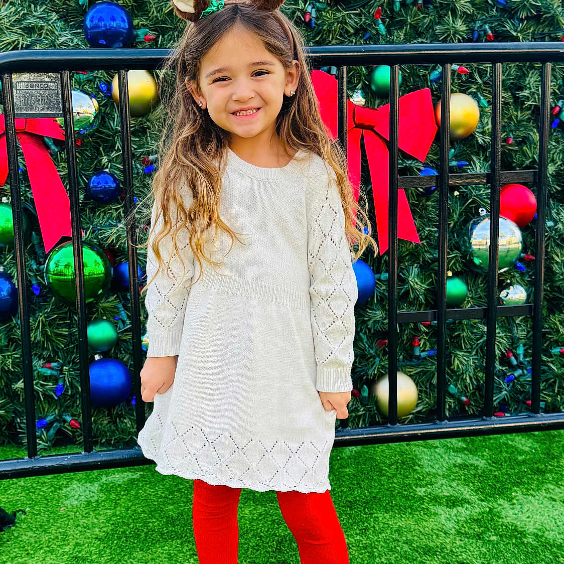Quinn is registered to the contest to win money with this photo: child, clothing, face, female, footwear, girl, grass, hair, happy, head, outdoors, pants, person, photography, plant, portrait, shoe, sleeve, smile, standing