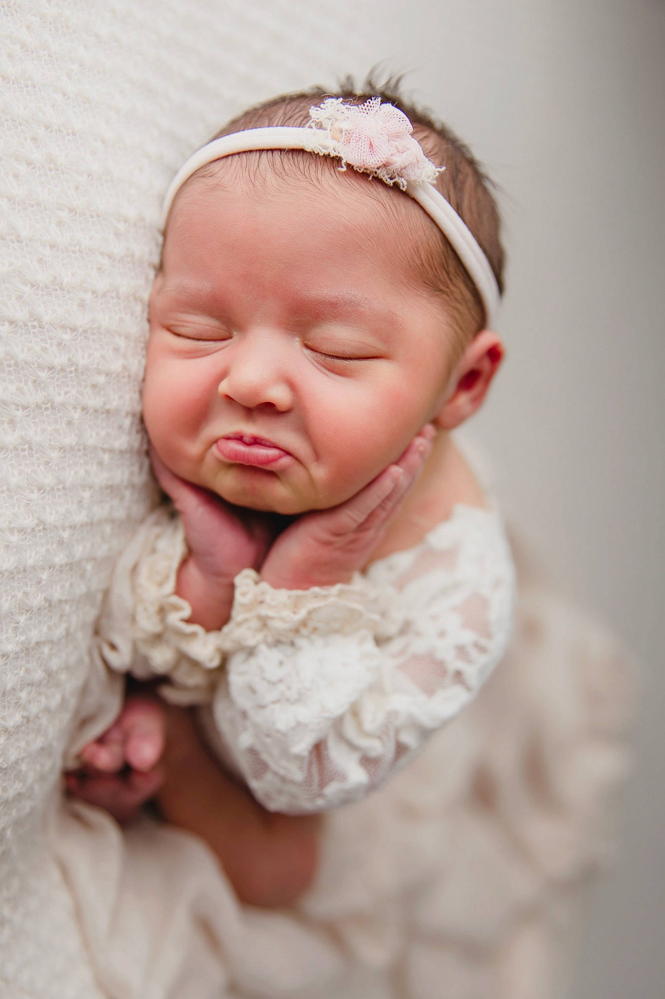 Quinn is registered to the contest to win money with this photo: baby, baby_toddler_clothing, bridal_accessory, cheek, child, close_up, comfort, dress, eyelash, finger, flash_photography, gesture, hair_accessory, happy, headpiece, iris, lip, nose, person, skin