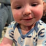 Desmond joined the competition — help win amazing prizes! baby, child, face, smile, onesie, patterned_clothing, close_up, indoor, cute, infant, chubby_cheeks, curious, person, skin, head, young_child, baby_garment, arm, expression, portrait