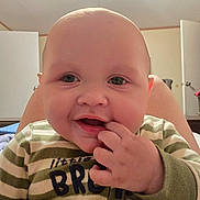 Grayson joined the competition — help win amazing prizes! baby, infant, smiling, face, hand, fingers, onesie, striped_clothing, indoor, room, door, furniture, child, cute, happy, portrait, young, person, head, skin