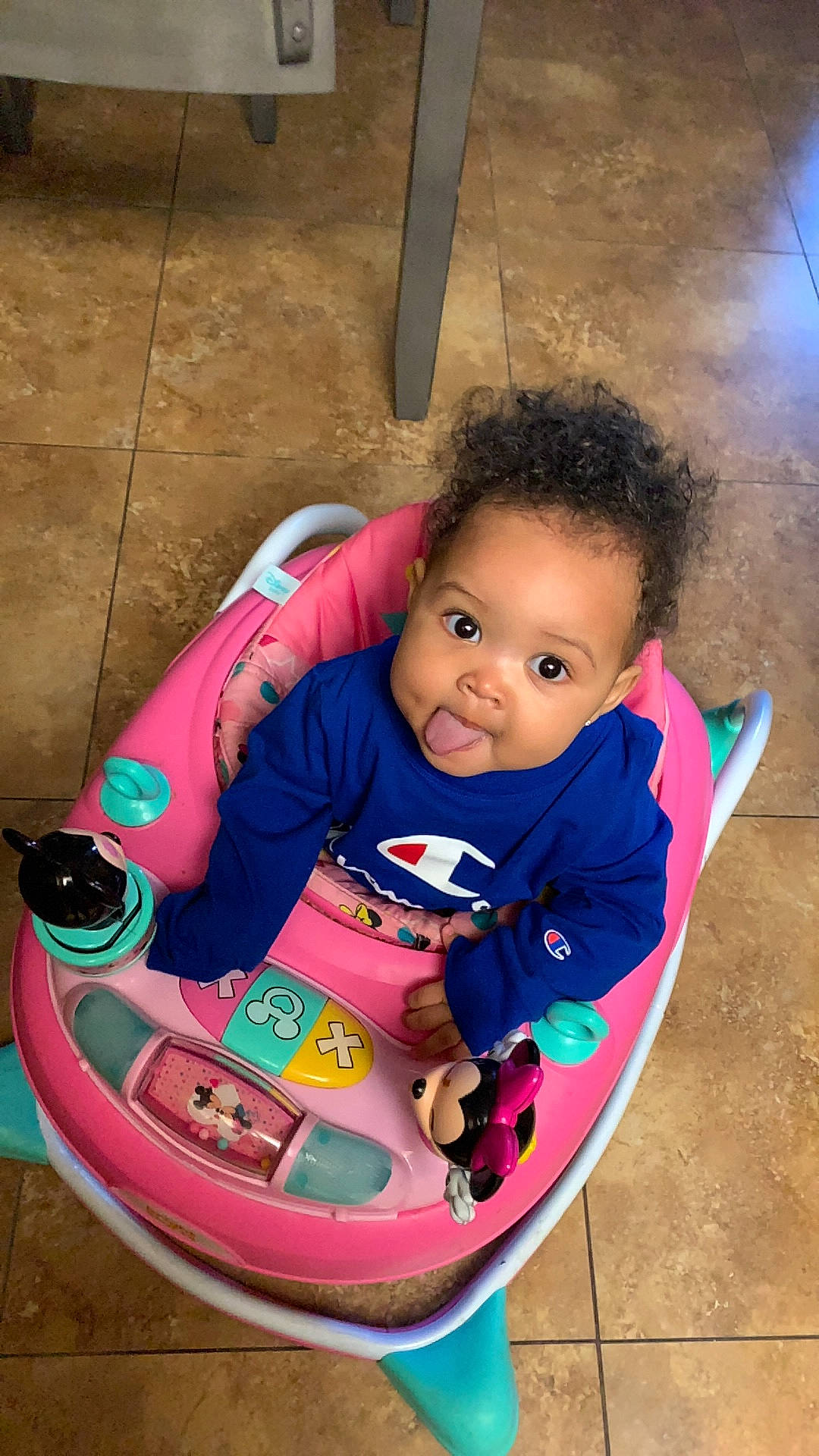 Kyla is registered to the contest to win money with this photo: baby, baby_playing_with_toys, baby_products, baby_toddler_clothing, child, face, facial_expression, fun, grass, happy, leisure, magenta, outdoor_play_equipment, person, pink, recreation, riding_toy, sitting, skin, toddler