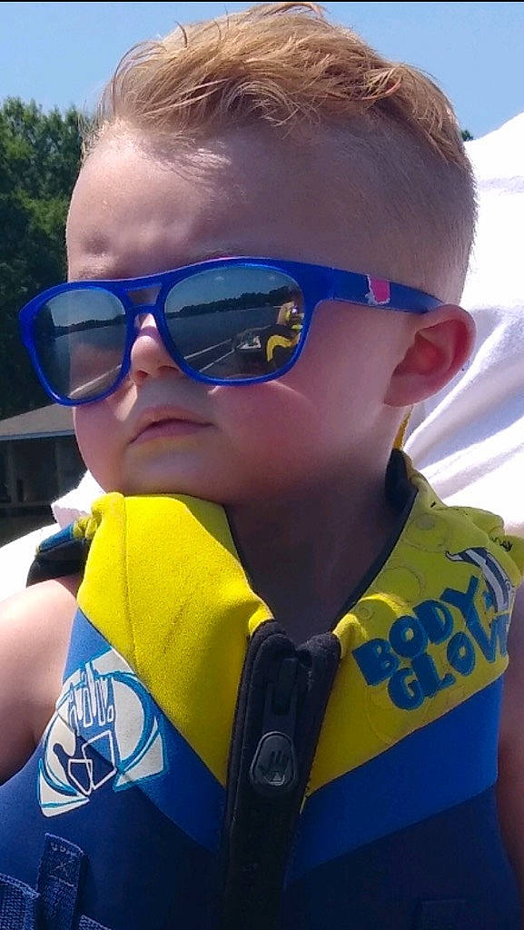 J.j. is registered to the contest to win money with this photo: cool, electric_blue, eyewear, fun, glasses, goggles, lifejacket, neck, person, personal_protective_equipment, photography, recreation, sunglasses, vision_care, wetsuit