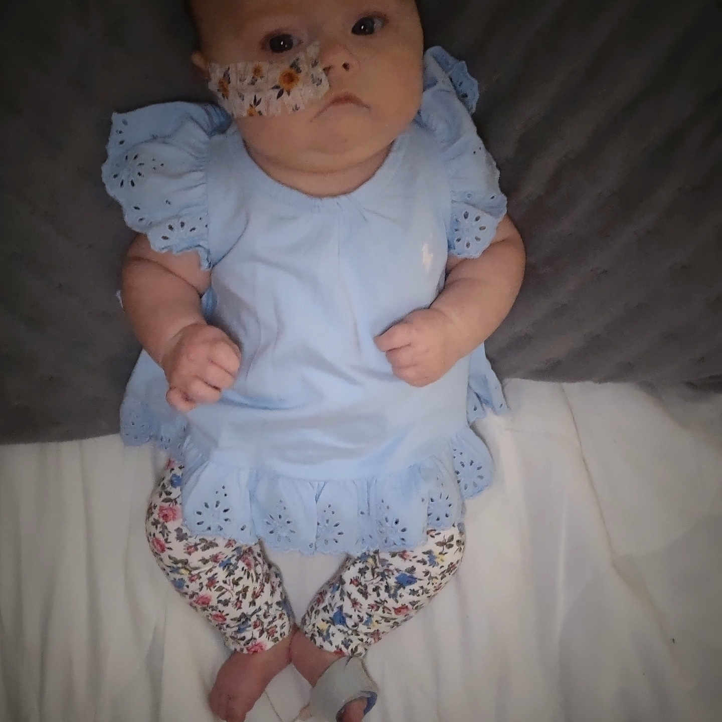 Harper-Mae is registered to the contest to win money with this photo: baby, bed, bodypart, clothing, couch, cushion, dress, face, finger, furniture, hand, head, homedecor, newborn, pants, person, photography, portrait, sitting, sleeve