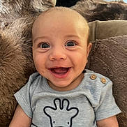 Ovi joined the competition — help win amazing prizes! baby, smiling, face, infant, cute, clothing, onesie, giraffe, illustration, happy, portrait, fuzzy_blanket, closeup, child, sitting, indoors, skin, head, eyes, mouth