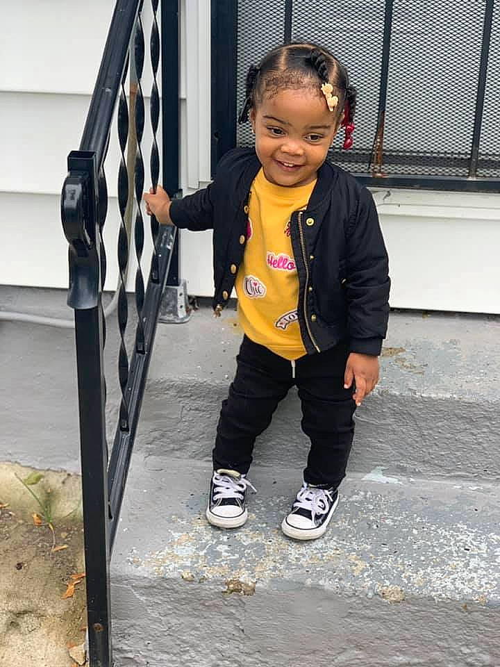 Amore is registered to the contest to win money with this photo: child, joy, outerwear, person, product, smile