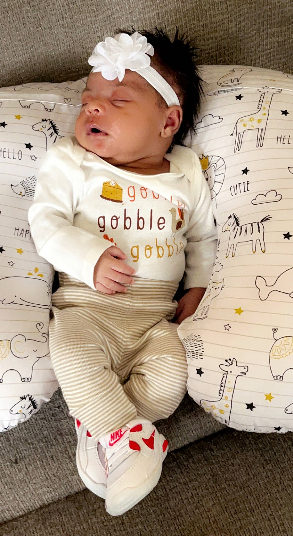 Alani joined the competition — help win amazing prizes! baby, baby_toddler_clothing, cap, child, cool, fashion_accessory, flooring, font, happy, hat, knee, long_sleeved_t_shirt, pattern, people, person, sitting, sleeve, t_shirt, thigh, toddler