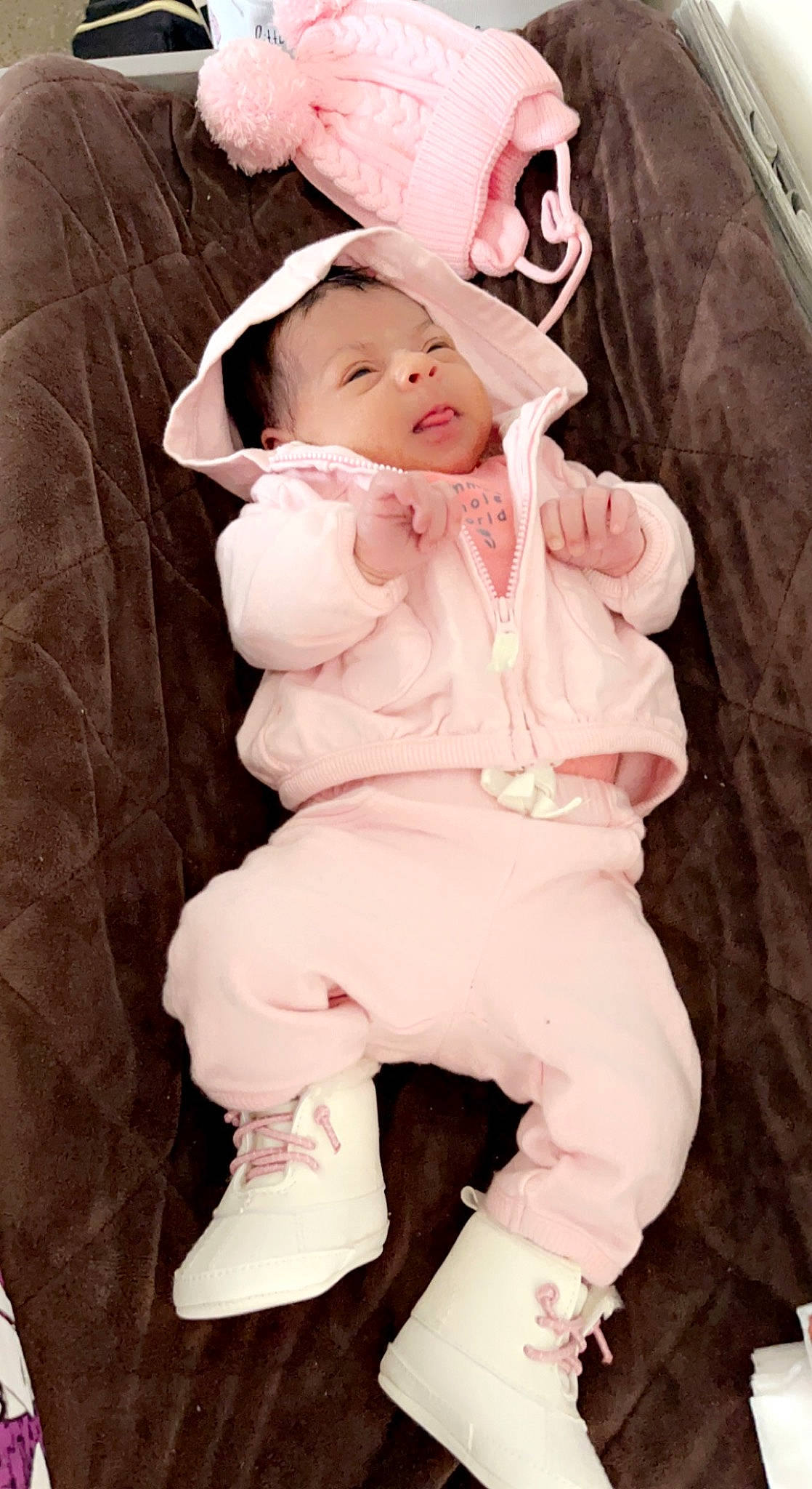 Alani is registered to the contest to win money with this photo: baby, baby_products, baby_safety, baby_sleeping, baby_toddler_clothing, cheek, child, comfort, face, fashion_accessory, fur, linens, magenta, pattern, peach, person, pink, sitting, sleeve, thigh