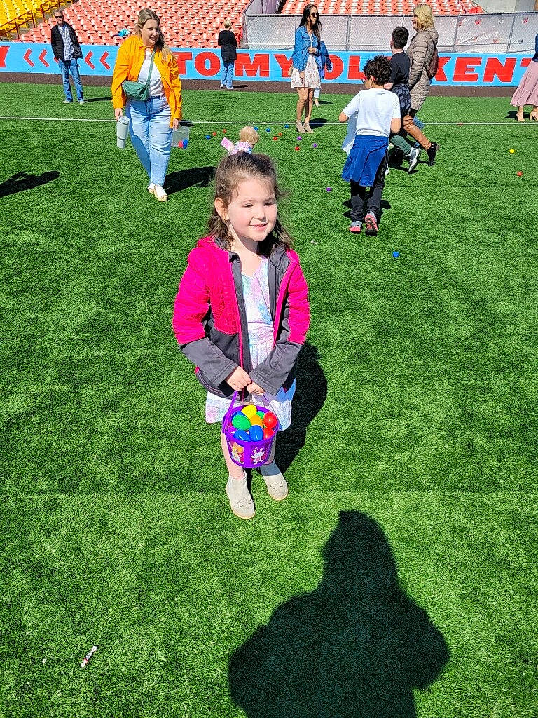 Avianna is registered to the contest to win money with this photo: ball, child, competition_event, event, fun, grass, grass_family, grassland, groundcover, joy, lawn, leisure, people_in_nature, person, play, player, recreation, smile, team, team_sport