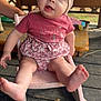 Kimber is registered to the contest to win money with this photo: baby, blue_eyes, child, cute, daylight, feet, furniture, hand, headwrap, legs, outdoor, pink_clothing, playful, portrait, rocking_chair, sitting, smiling, table, wooden_floor, young_child