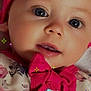 baby, face, headband, pink, blue_eyes, bow, clothing, floral_pattern, closeup, sparkles, infant, cute, child, portrait, adorable, soft_lighting, skin, expression, young, fashion