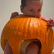 Isaiah joined the competition — help win amazing prizes! baby, pumpkin, diaper, feet, hands, face, orange, cute, infant, playful, hollow, chewing, messy, skin, toes, leg, indoor, table, holiday, halloween