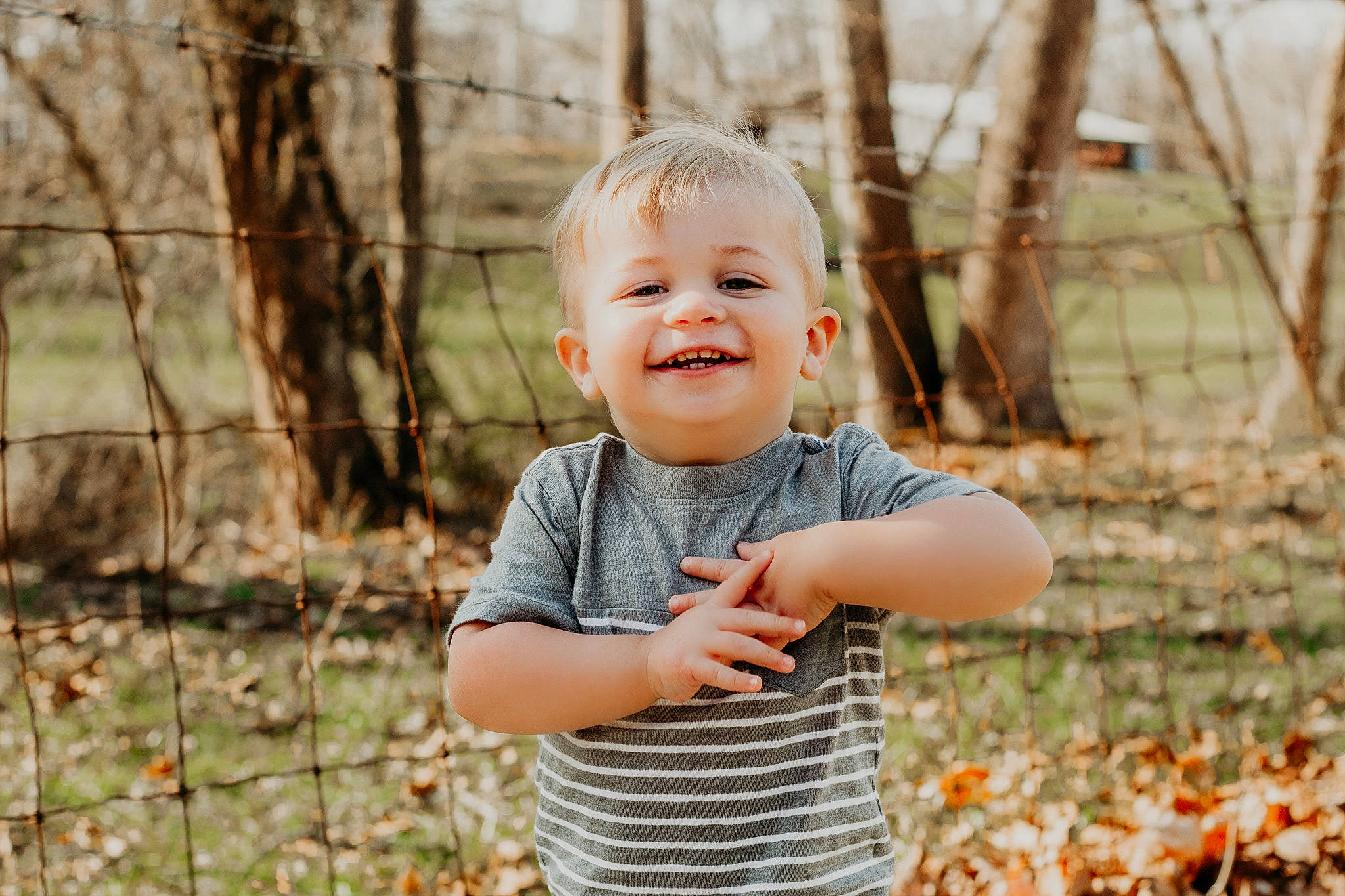 Deklan is registered to the contest to win money with this photo: baby, baby_laughing, baby_toddler_clothing, blond, child, eye, face, forest, grass, happy, joy, leaf, leisure, natural_landscape, people_in_nature, person, plant, smile, t_shirt, toddler