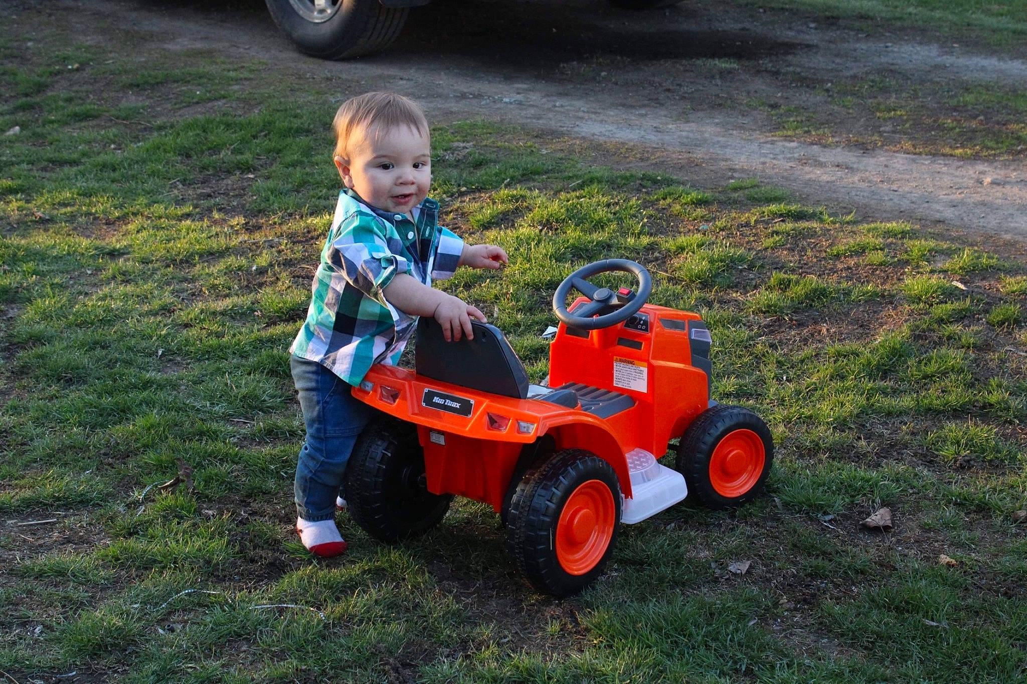 Tydus joined the competition — help win amazing prizes! asphalt, automotive_tire, automotive_wheel_system, baby, child, fun, grass, lawn, leisure, motor_vehicle, person, plant, recreation, riding_toy, soil, tire, toddler, toy, toy_vehicle, vehicle