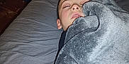Bentley joined the competition — help win amazing prizes! bed, blanket, child, closed_eyes, clothing, cozy, fabric, face, gray, head, indoors, laundry_basket, nap, person, resting, room, sheet, sleeping, soft, tired
