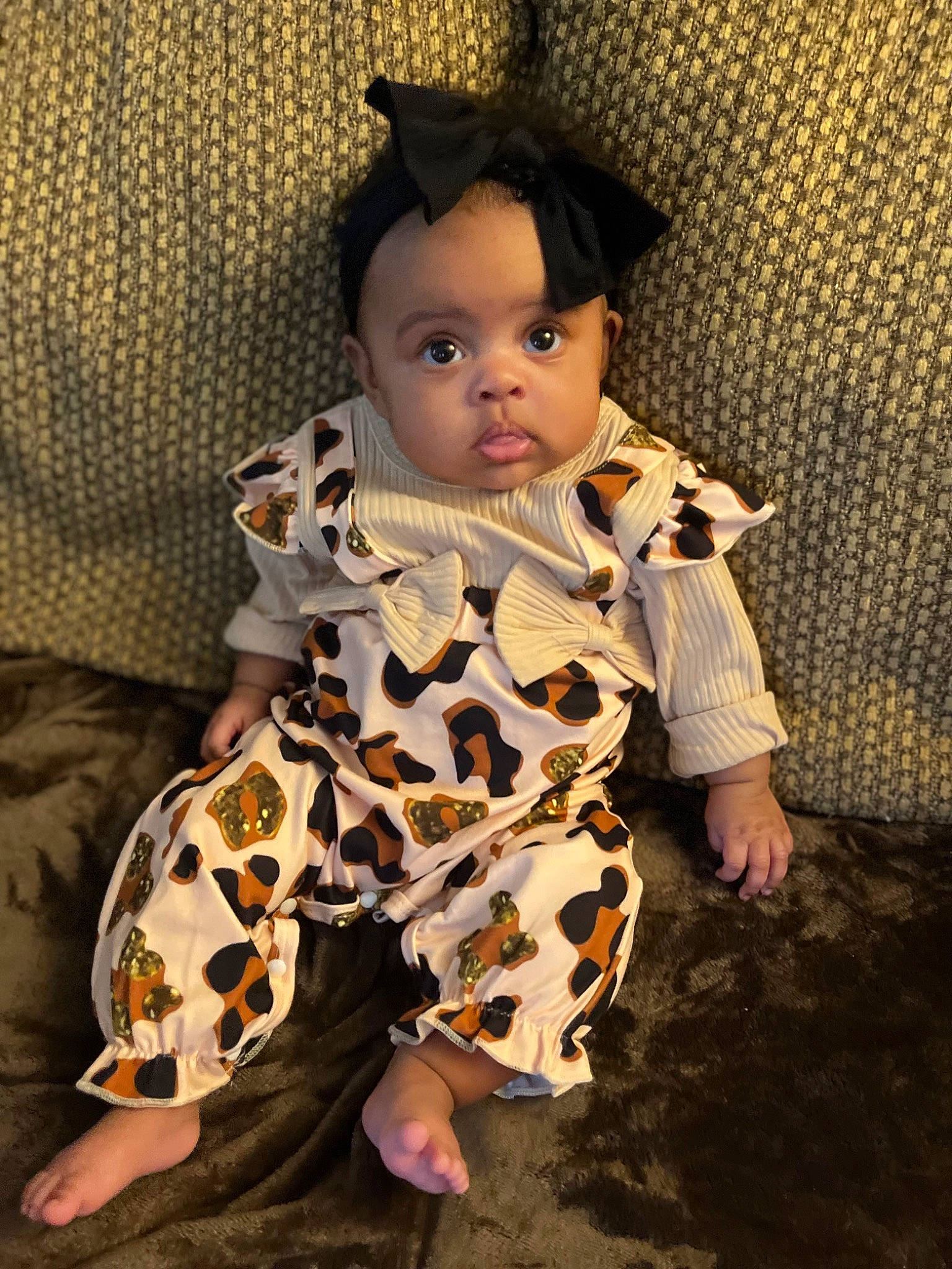 Ocean is registered to the contest to win money with this photo: baby, baby_toddler_clothing, cheek, costume, costume_hat, day_dress, eye, face, fashion_design, hat, head, iris, outerwear, pattern, person, sitting, skin, sleeve, t_shirt, textile